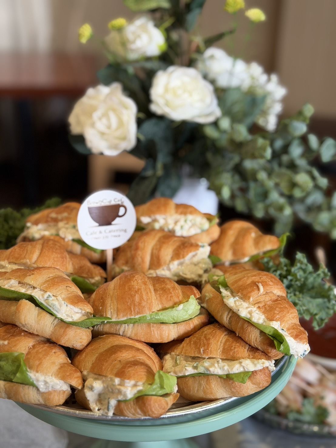 Croissant sandwich platter with Brown Cup Cafe branded pick