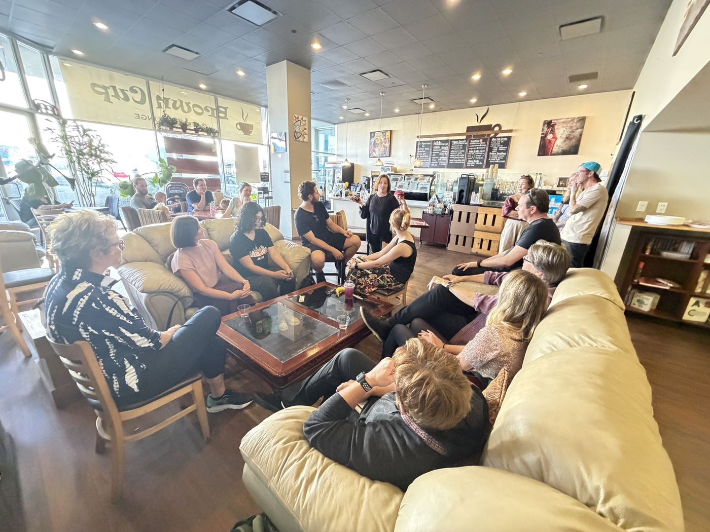 A community gathering in the Brown Cup lounge area